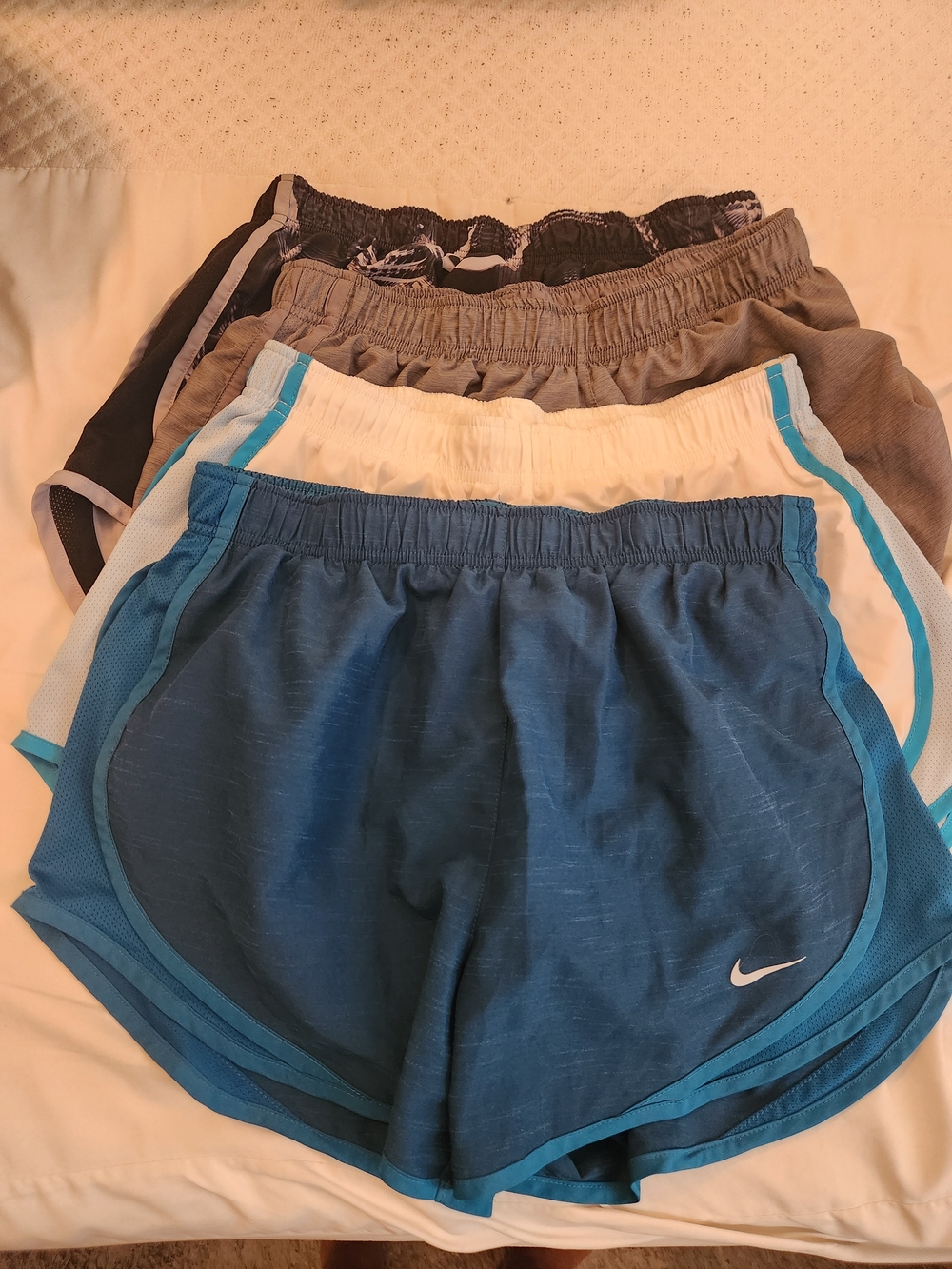 4 Pair Of Nike Shorts. Gray, White, Teal, Black Athletic Shorts